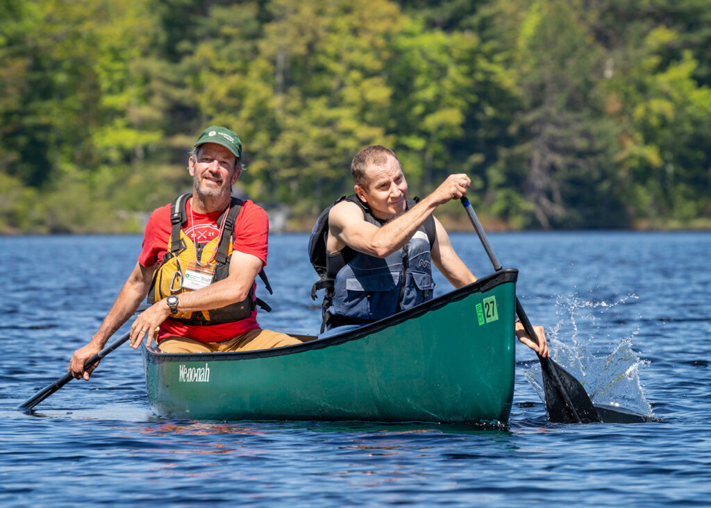 Two people paddling a canoe