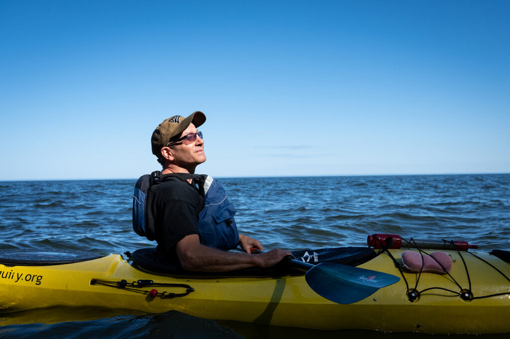 Individual sitting in a canoe