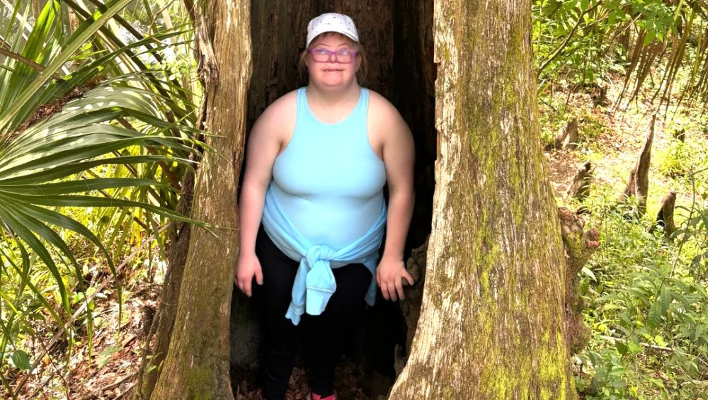 Woman standing in a tree
