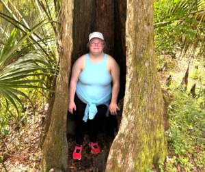 Woman standing in a tree