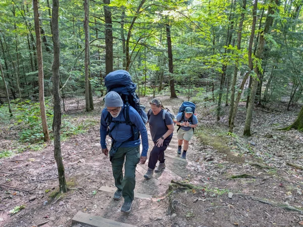 Porcupine Mountain backpackers ascending stairs